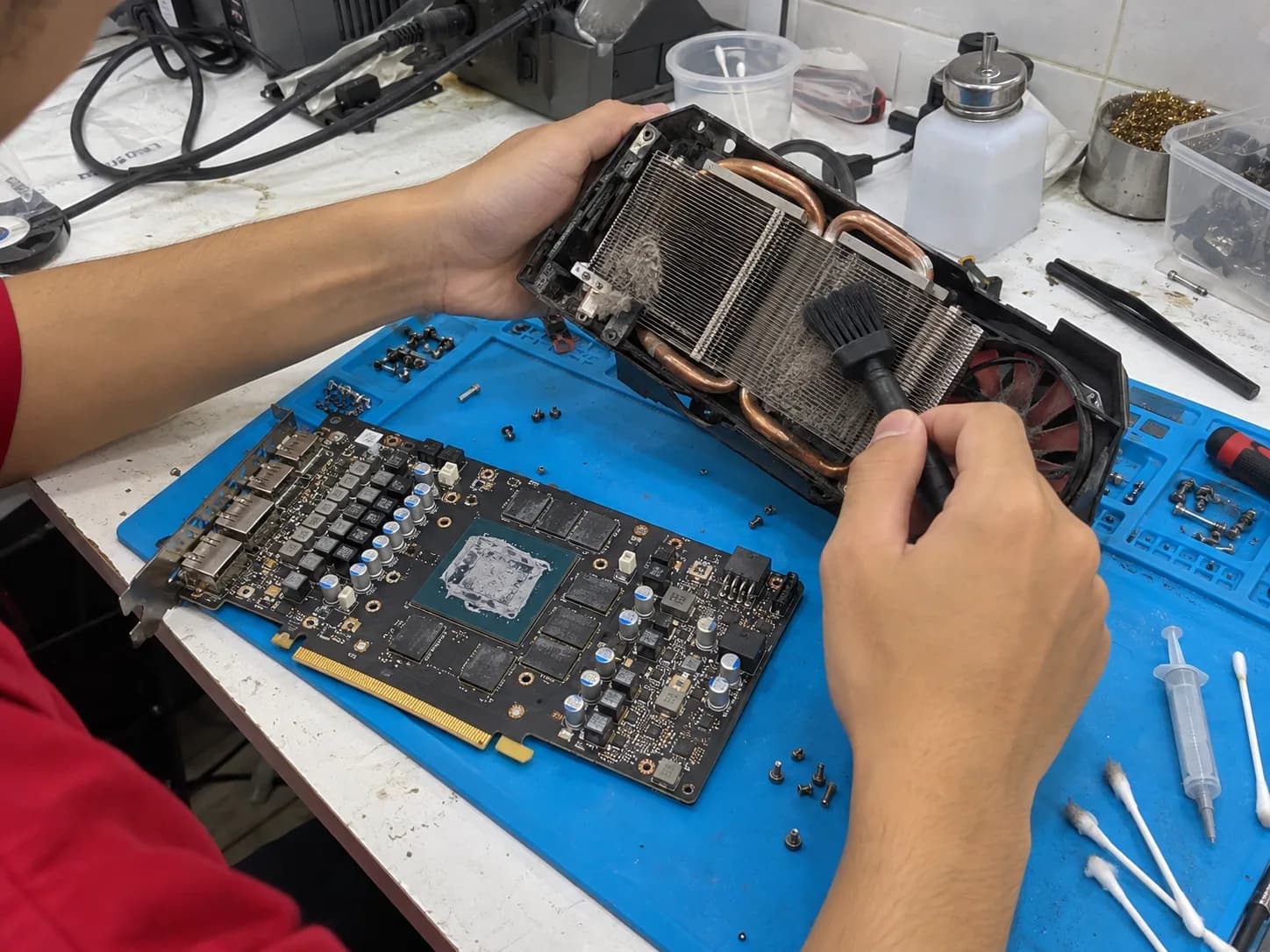 Graphic card with the cooler removed for cleaning and new thermal paste